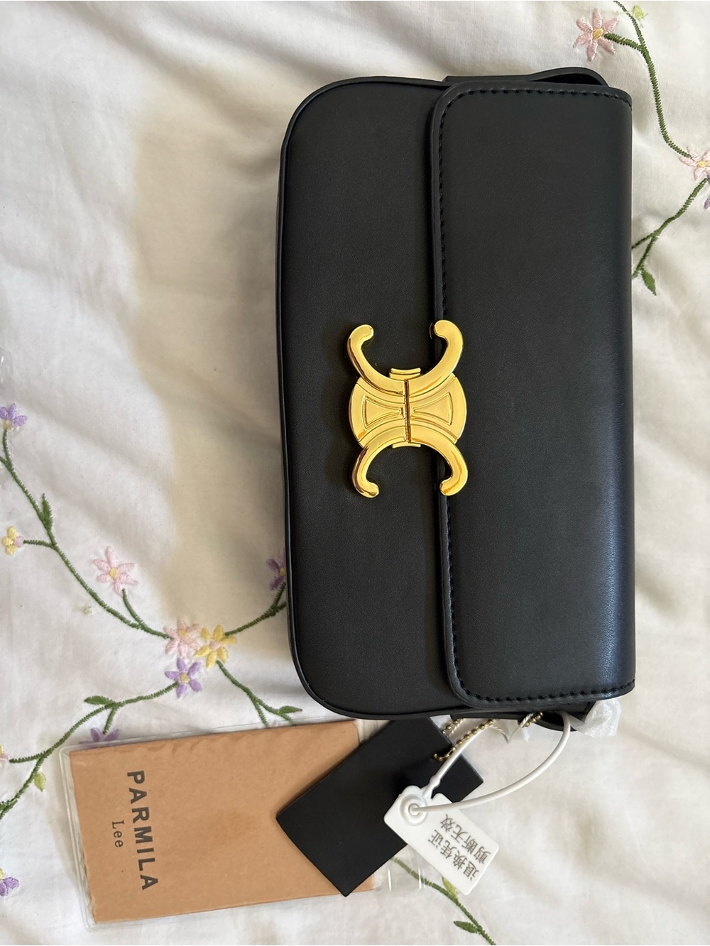 Black Shoulder Bag with Gold Emblem